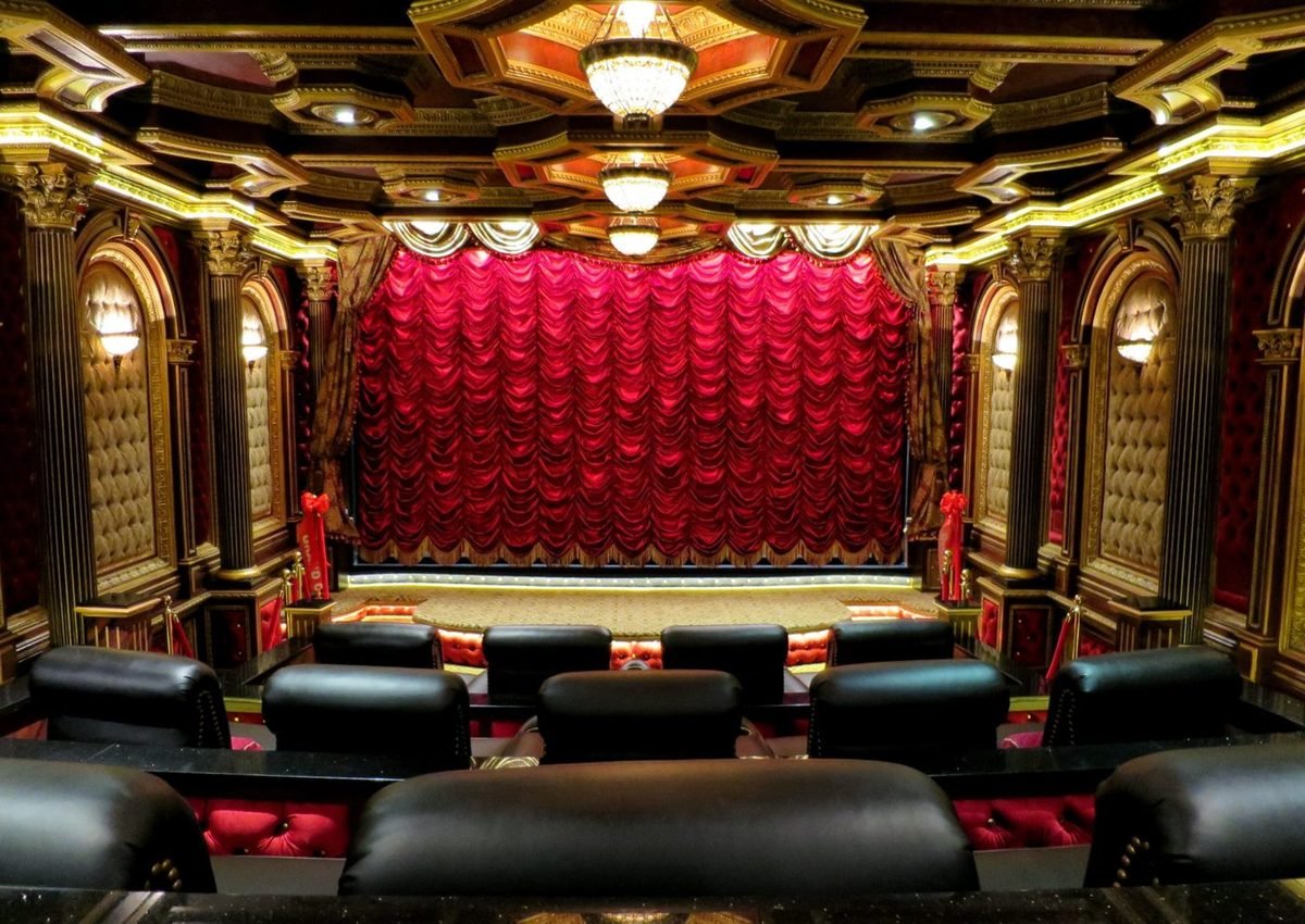 Grand theater with a red swagged stage curtain